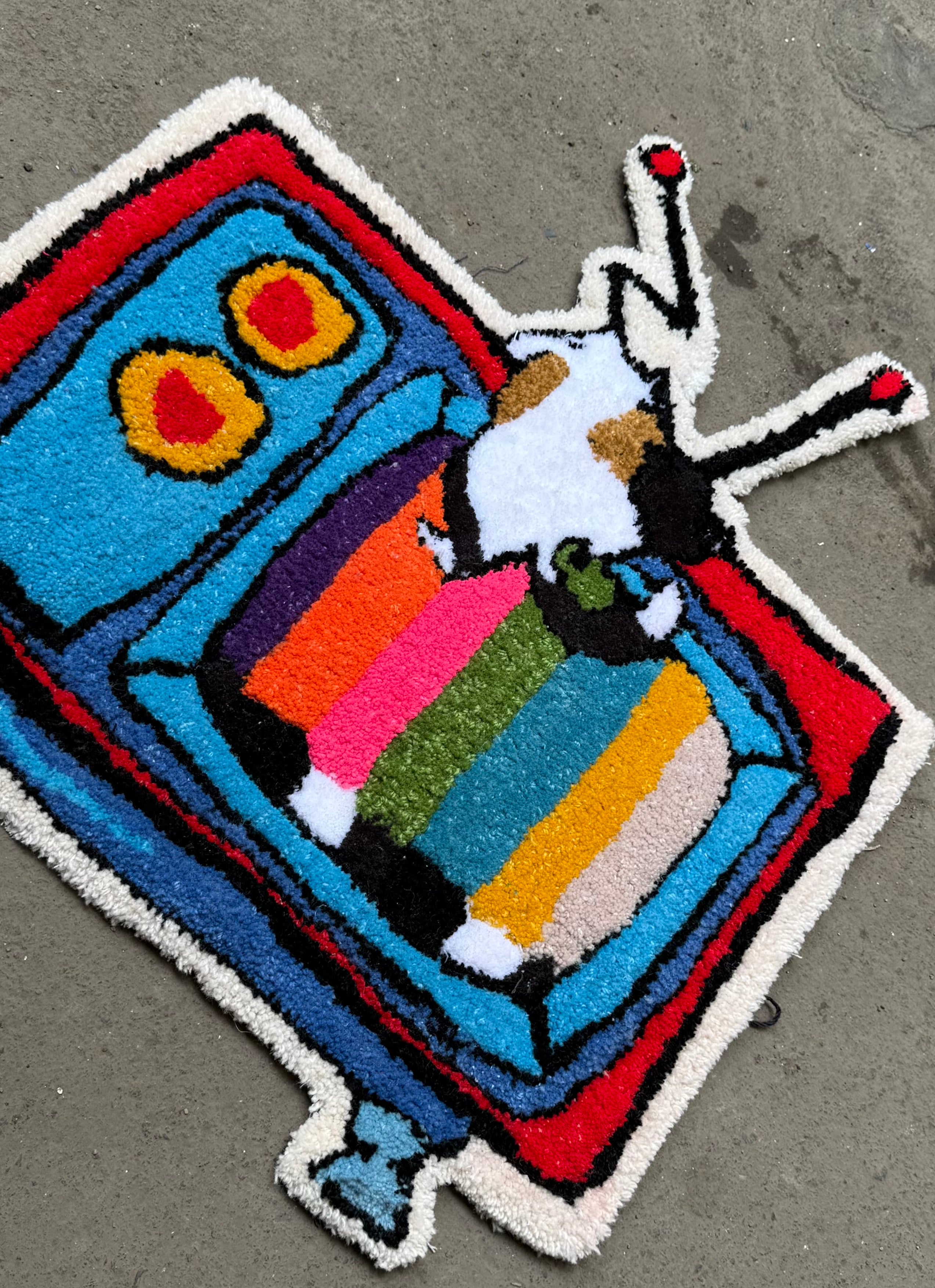 The TV Topple Hand tufted Rug by The Clumsy Studio